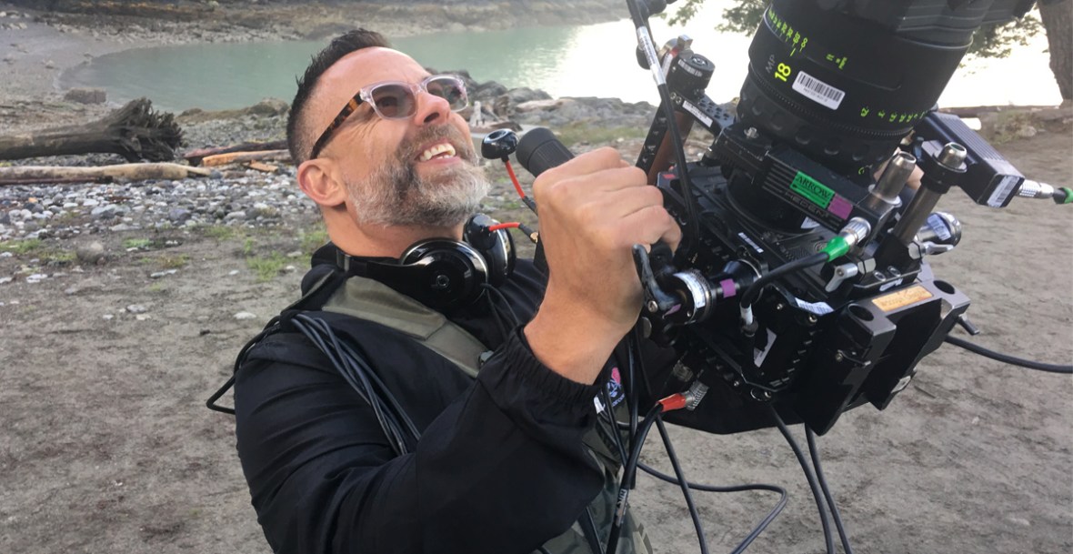 James Bamford holding a camera